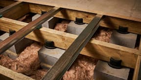 Acoustic floor in section demonstrating its parts