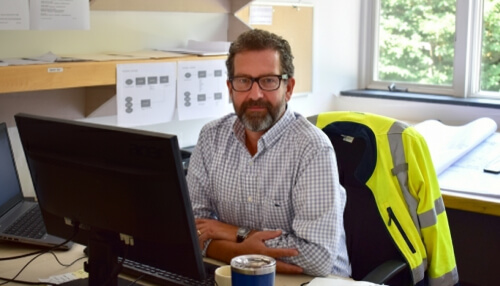 Construction project management in the office at the desk