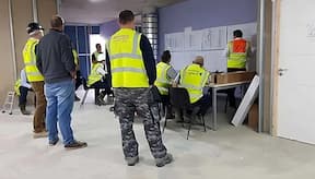 Consturction site supervisor's gathering during progress meeting