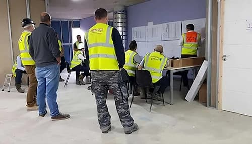 NVQ Level 4 construction site supervisors in a meeting