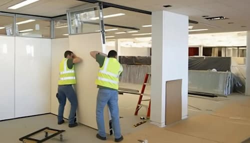 NVQ Level 2 modular partition installers working in the office