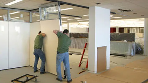 NVQ Level 2 modular partition installers working in the office