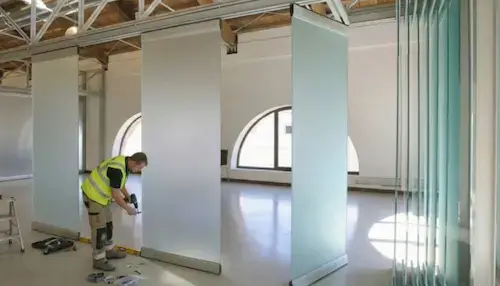 Moving Wall Office Partition NVQ Level 2 installer on site