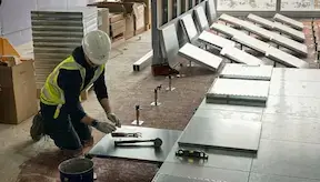 Raised access floor installation in progress