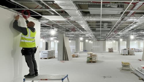 NVQ Level 2 ceiling fixer installing MF ceiling