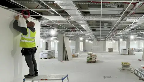 Suspended Ceiling NVQ Level 2 fixer installing ceiling grid