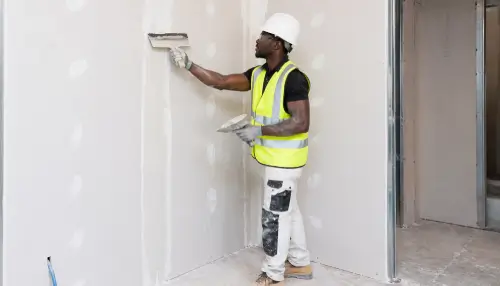 Tape and Jointing NVQ Level 2 finisher completing dry lining joints